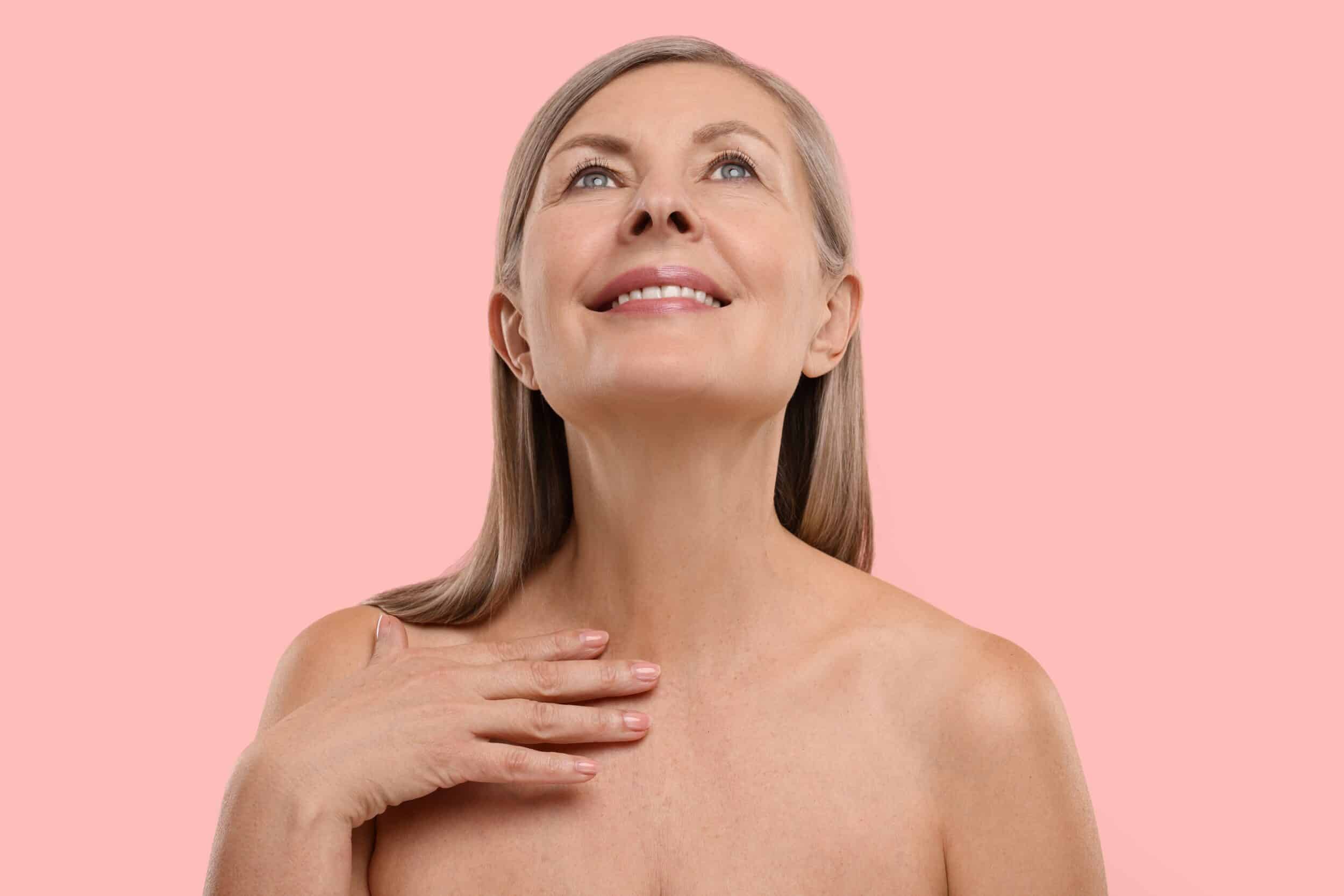 Mature woman displaying sleek neck and chin after Kybella treatment