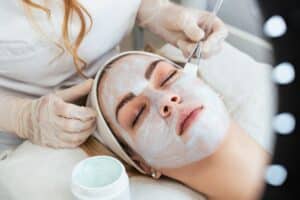 Woman receiving a facial at a med spa