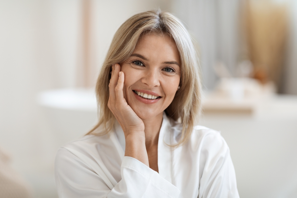 Mature woman with youthful looking skin after regular microneedling sessions. Mature woman with youthful looking skin after regular microneedling sessions.